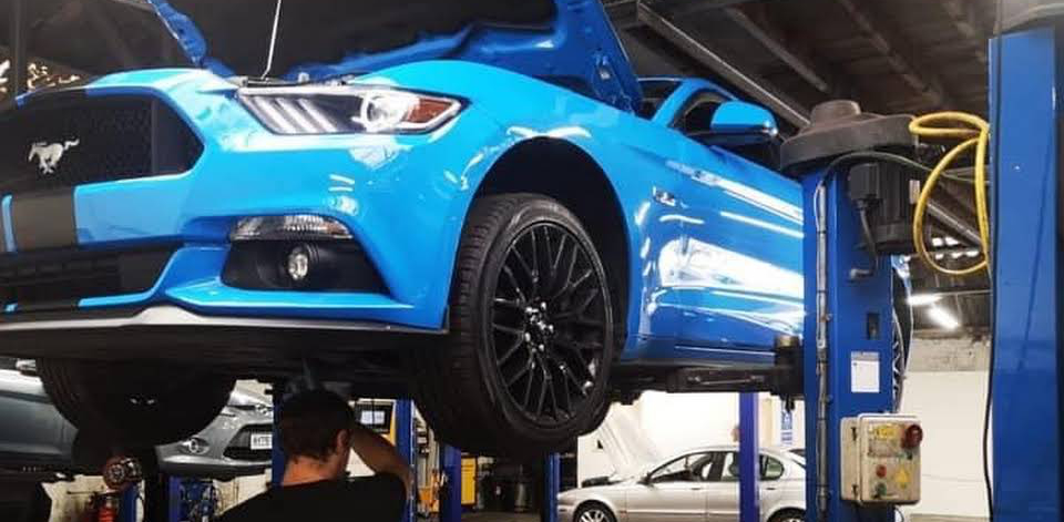 Mechanic inspecting under a vehicle for its service - Car Servicing Torquay